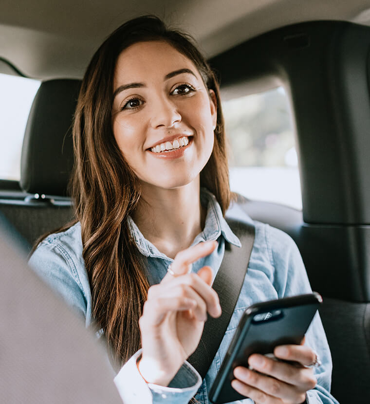 woman holding her phone