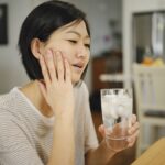 woman with tooth sensitivity after drinking ice water